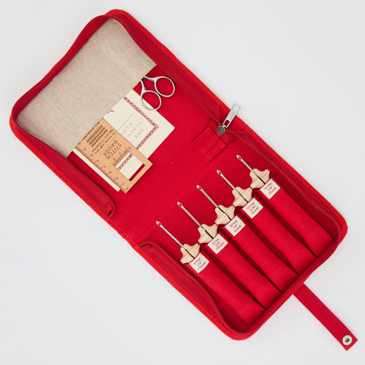 Oxford Punch Needle set in red case with five fine point needles, stitch gauge, scissors, and handbook