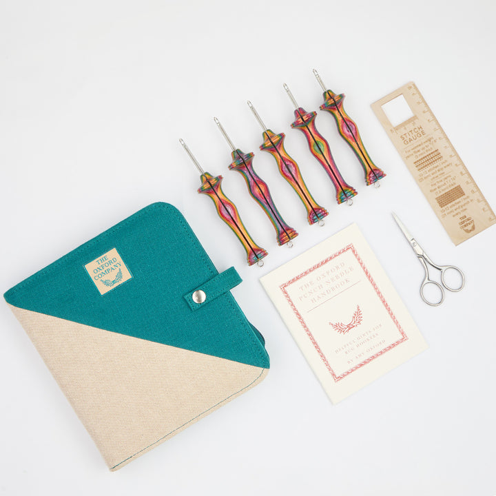 Oxford punch needles fine point kit in zippered case along with scissors, wooden stitch gauge and handbook.